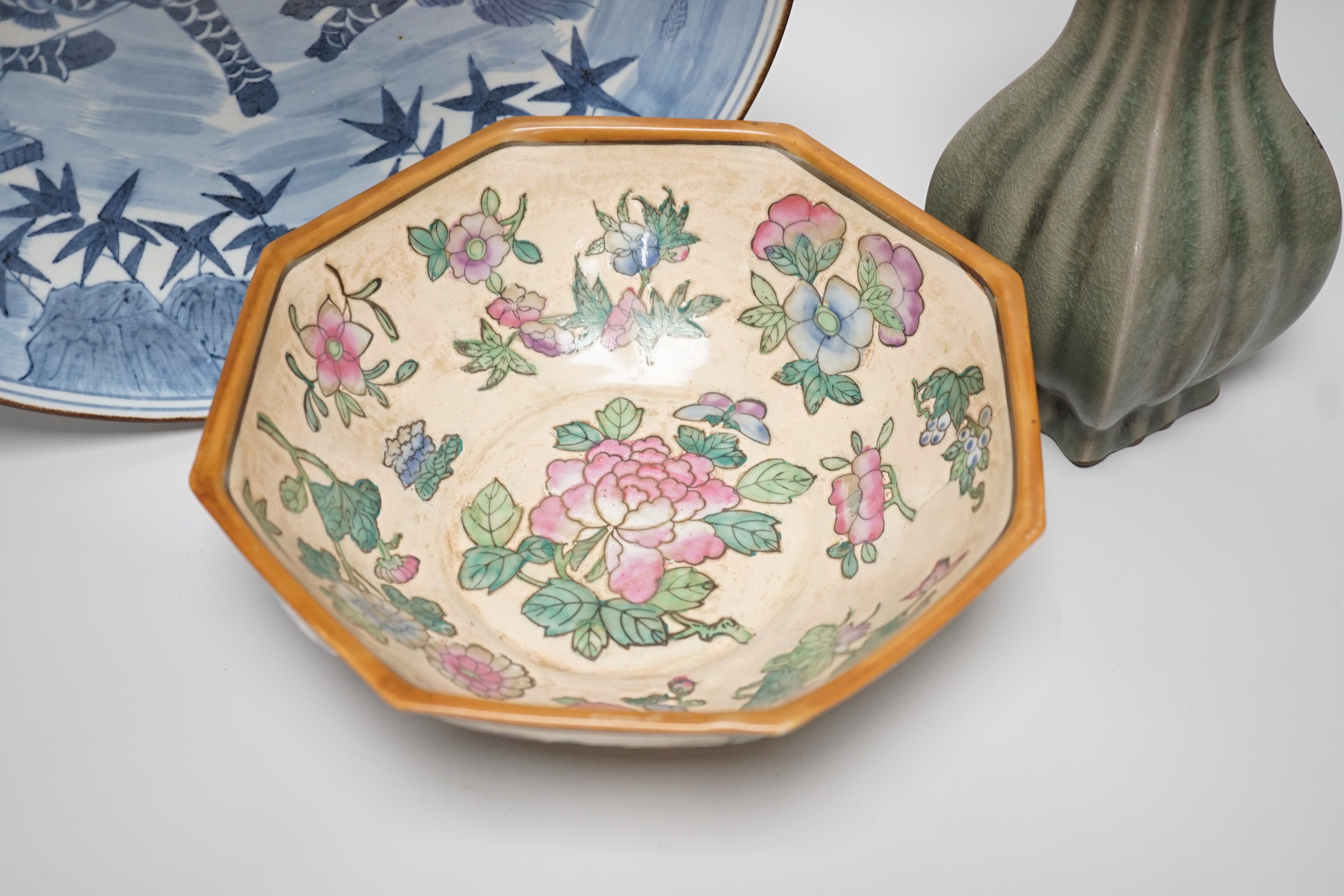 A Chinese blue and white ‘qilin’ dish, an octagonal bowl and a Korean celadon vase (3) largest 33cm diameter